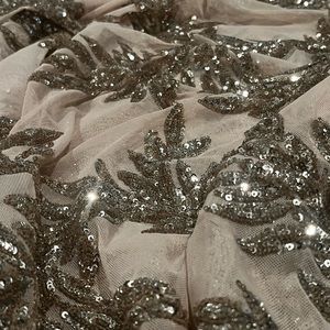 Net reception saree in beige color and with all over sequin work